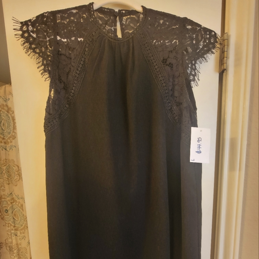 Black knee length dress with lace detail